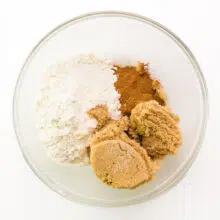 Ingredients for coffee cake filling are in a bowl, including brown sugar and flour.