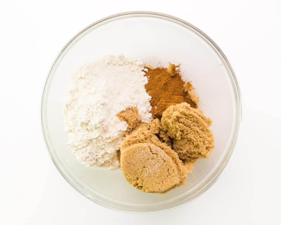 Ingredients for coffee cake filling are in a bowl, including brown sugar and flour.