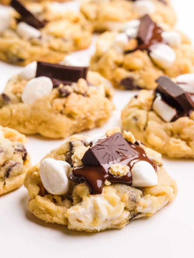 Several vegan s'mores cookies sit on a white countertop.
