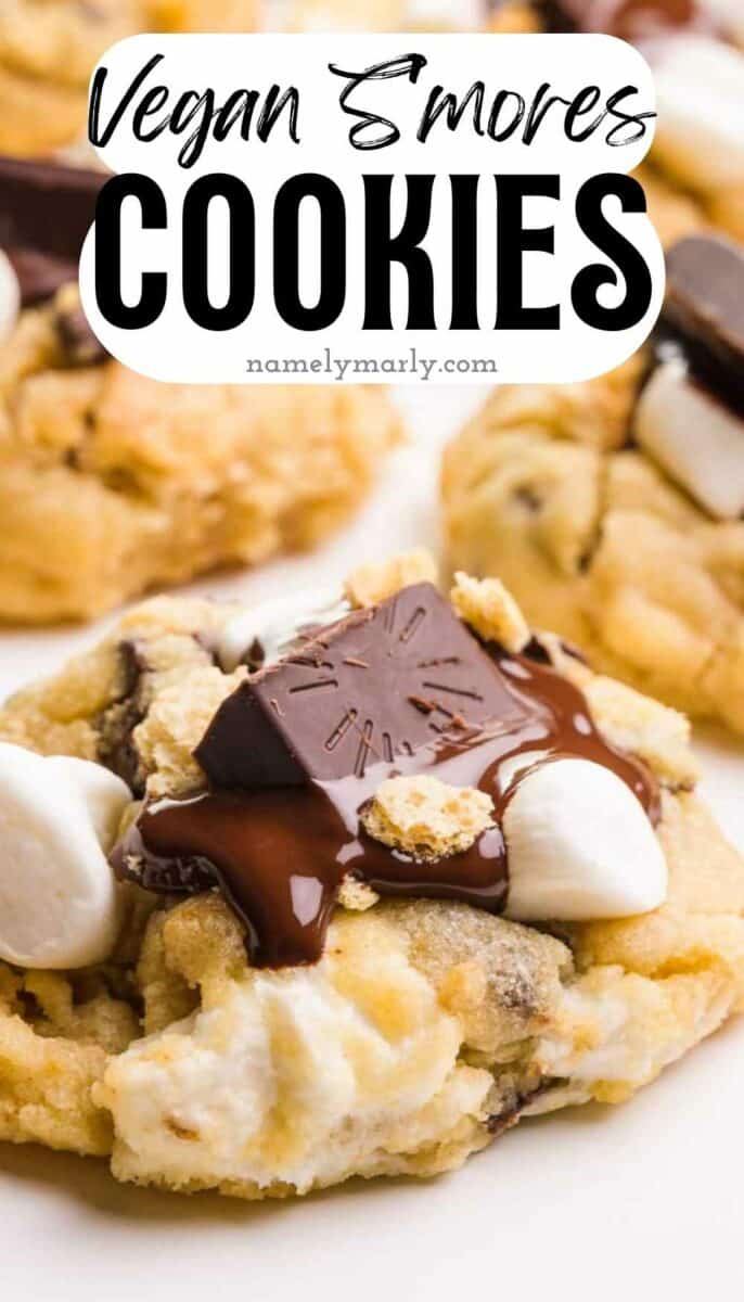 A cookie topped with melted chocolate and marshmallows.  The text reads, Vegan S'Mores Cookies.