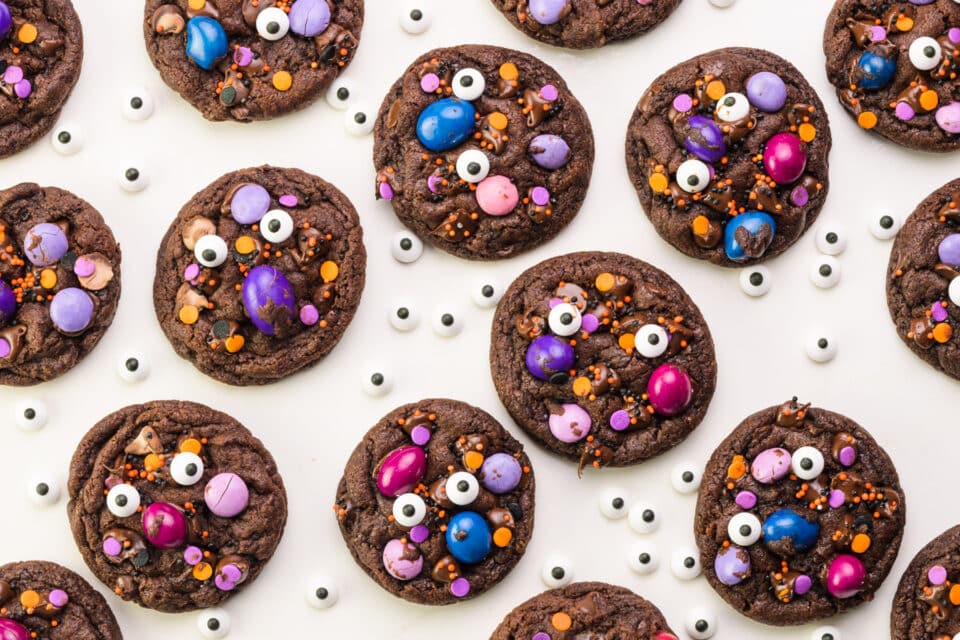 Looking down on Halloween cookies surrounded by candy eyes.
