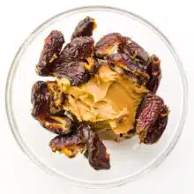 Dates and peanut butter are in a bowl.