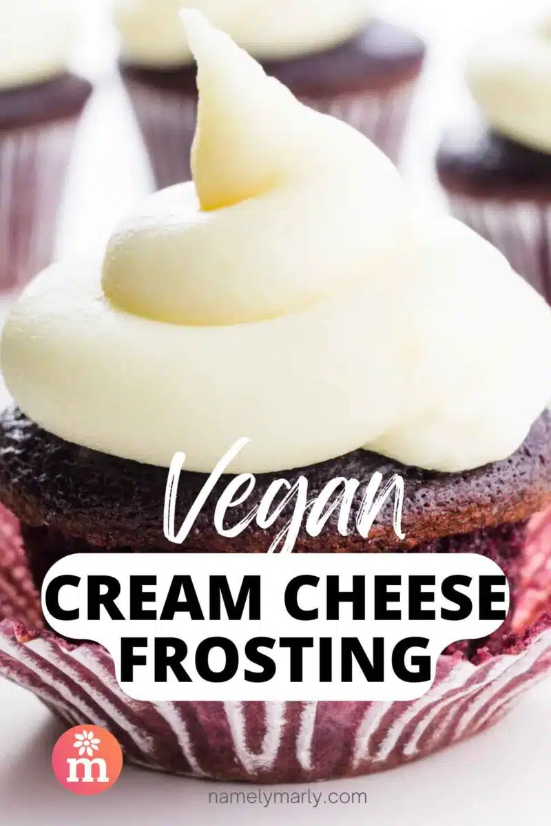 A red velvet cupcake has creamy white frosting on top. the text reads Vegan Cream Cheese Frosting.