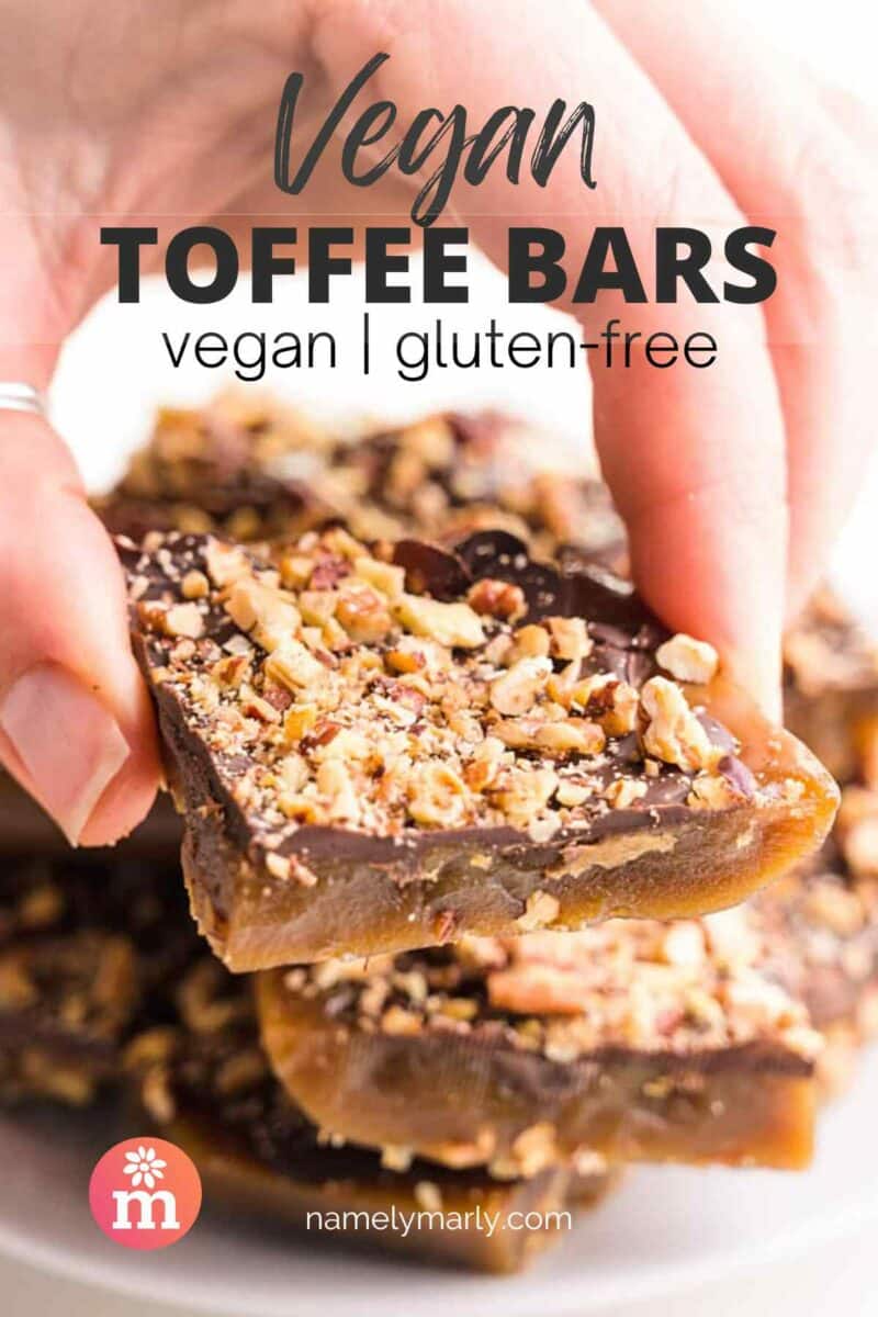 A hand holds a piece of toffee with nuts on top.  Read the text, Vegan Toffee Bars: Vegan and Gluten-Free.