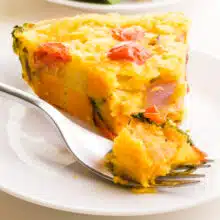 A slice of Just Egg Frittata has a bite taken out.