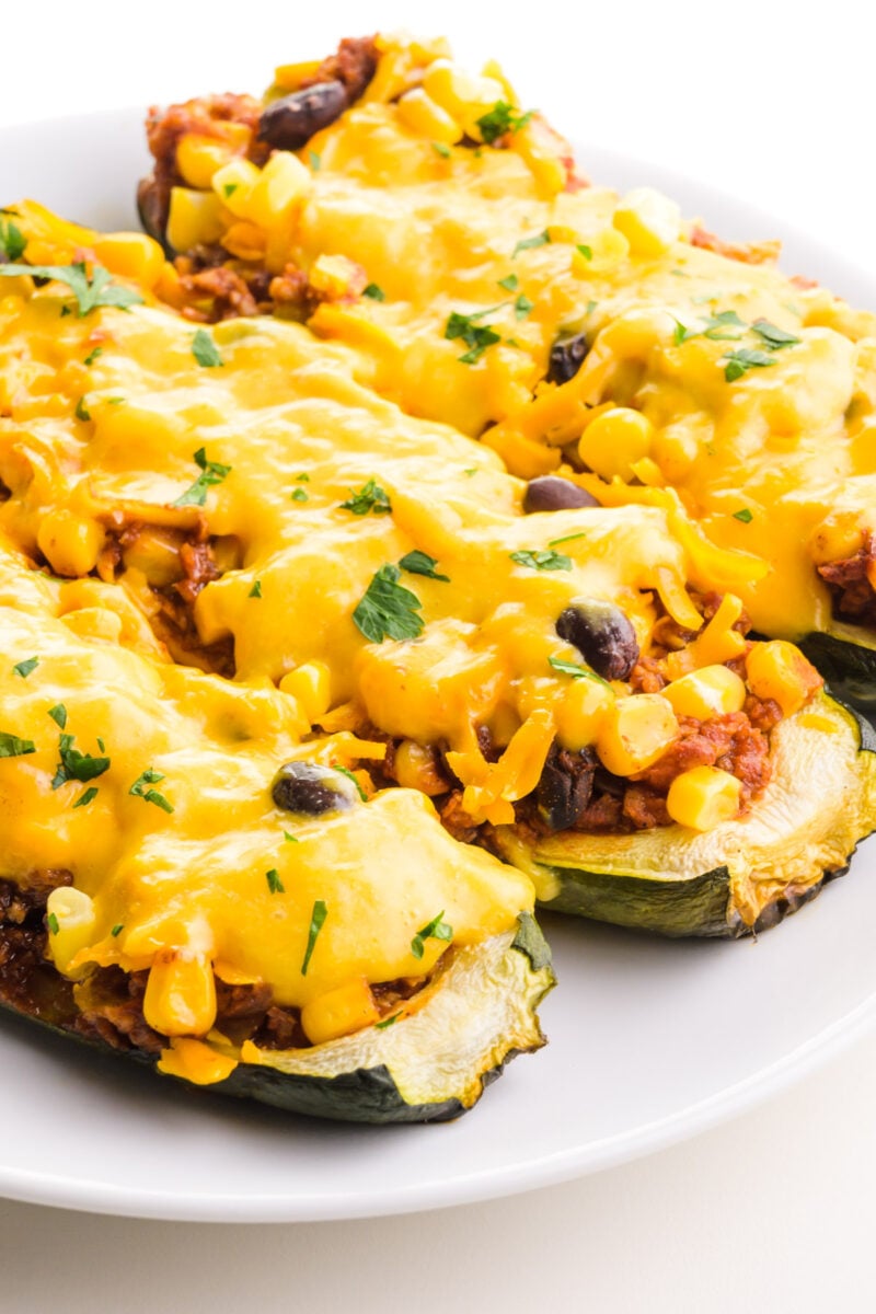 Vegan zucchini boats are on a plate.