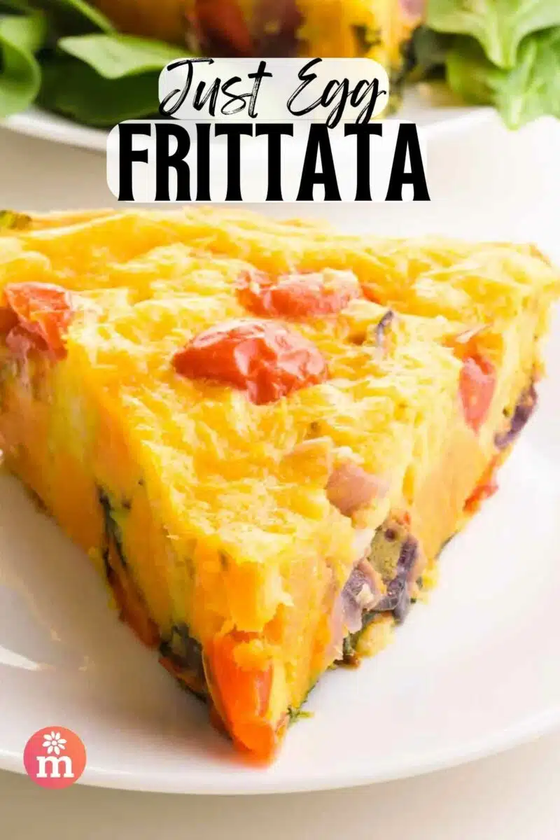 A slice of frittata sits on a plate. The text reads, Just Egg Frittata.