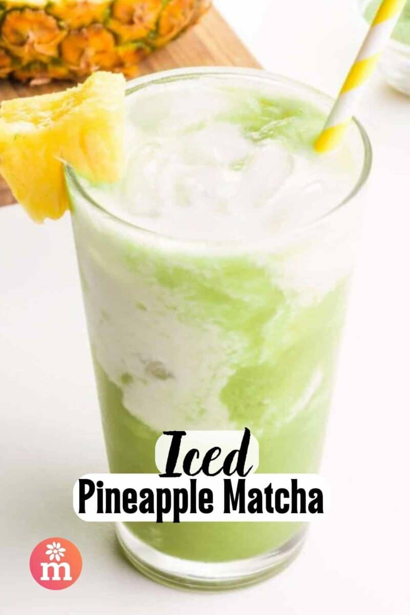 A glass of green and white liquid has a straw and a piece of pineapple in it.  The text reads, Iced Pineapple Matcha.
