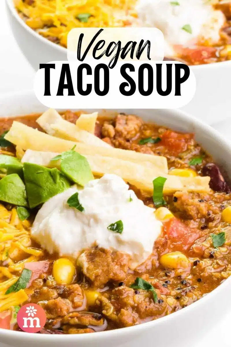 A bowl of soup has sour cream and tortilla strips on top. The text reads, Vegan Taco Soup.
