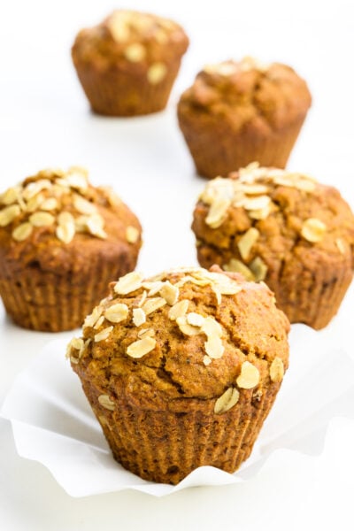 Several applesauce muffins sit next to each other.