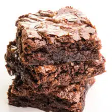 A closeup of a stack of three vegan brownies from a box mix.