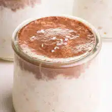 A closeup of bounty overnight oats with chocolate topping and flaky sea salt.