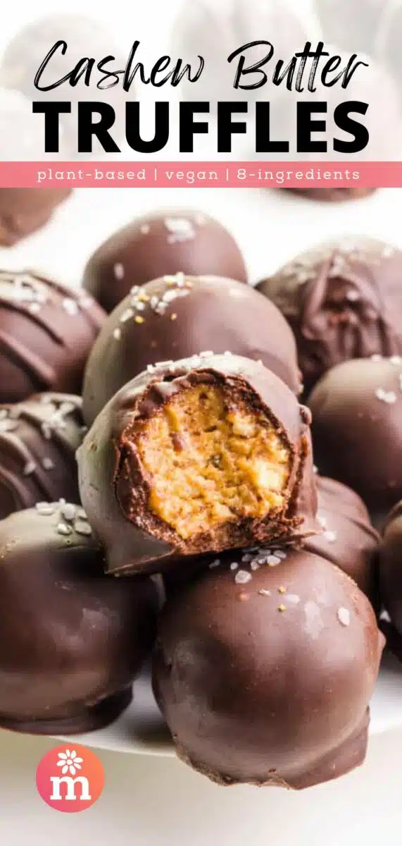 Nut butter balsl dipped in chocolate are sitting on a plate. The top one has a bite taken out. The text reads, Cashew Butter Truffles, plant-based, vegan, 8-ingredients.