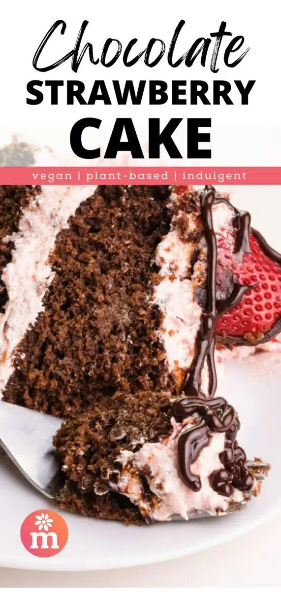 A slice of chocolate layer cake with strawberry frosting sits on its side on a plate. A bite rests on a fork in front of the slice. The text reads, Chocolate Strawberry Cake, vegan, plant-based, indulgent.