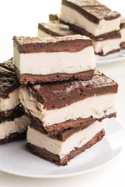 Two plates hold stacks of dairy-free ice cream sandwiches.