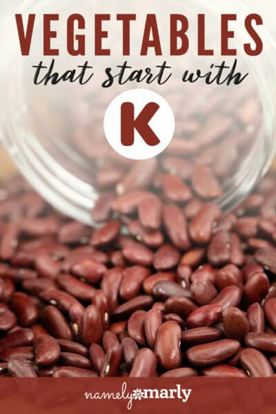 A bowl of red kidney beans is spilling over onto a table. The text reads, Vegetables that start with K.
