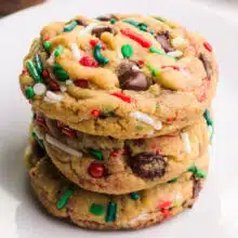 A sick of vegan Christmas chocolate chip cookies sit on a plate.