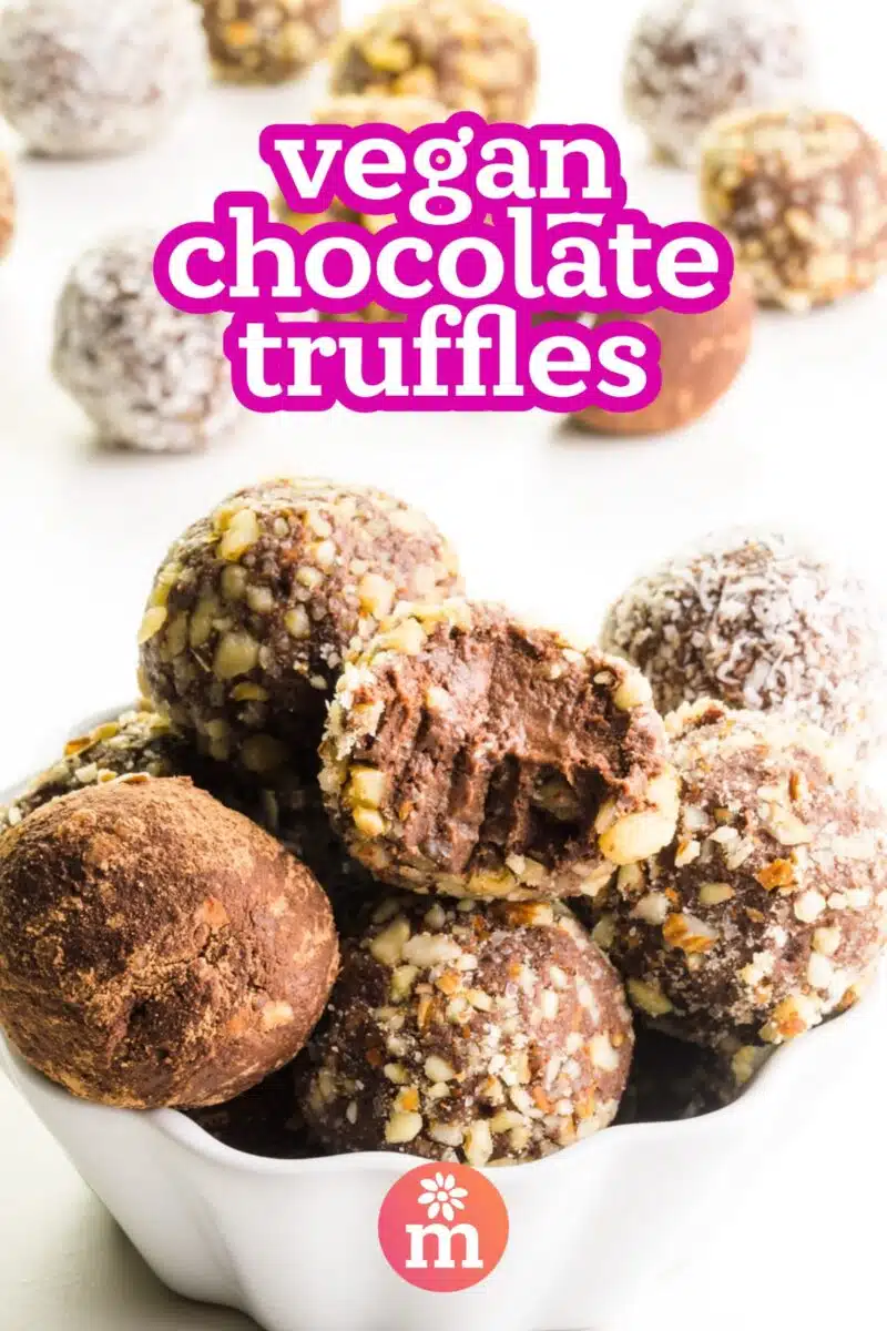 A bowl of chocolate balls shows one with a bite taken out. The text reads, Vegan Chocolate Truffles.