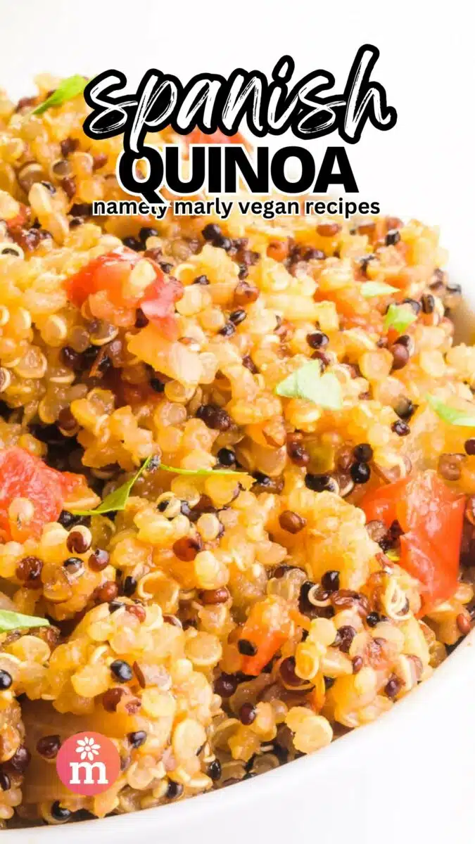 A bowl of quinoa has this text over it, Spanish Quinoa, Namely Marly Vegan Recipes.