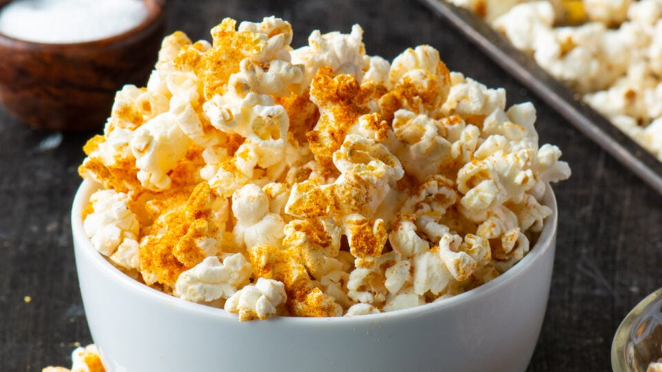 A closeup of seasoned popcorn in a bowl.