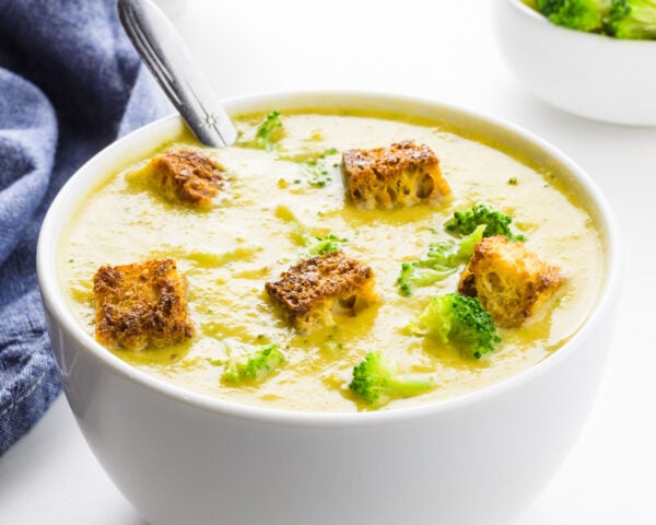A close-up of a bowl of creamy broccoli soup.