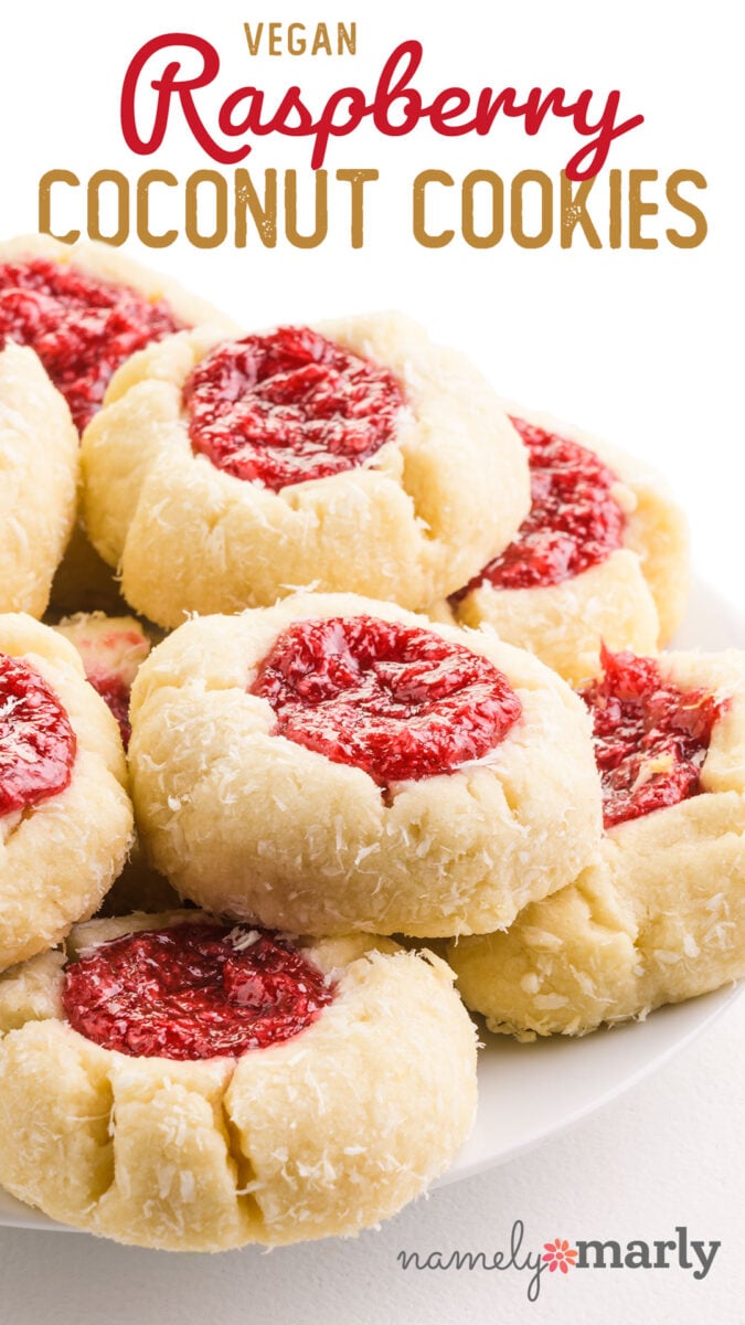 A plate full of shortbread cookies with raspberry filling and text that says, Vegan Raspberry Coconut Cookies
