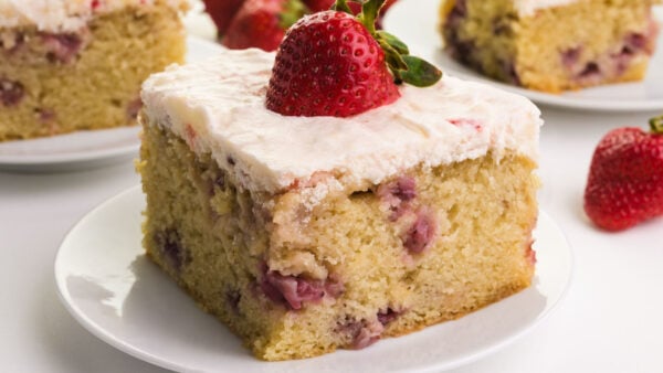 A slice of vegan strawberry cake on a plate.