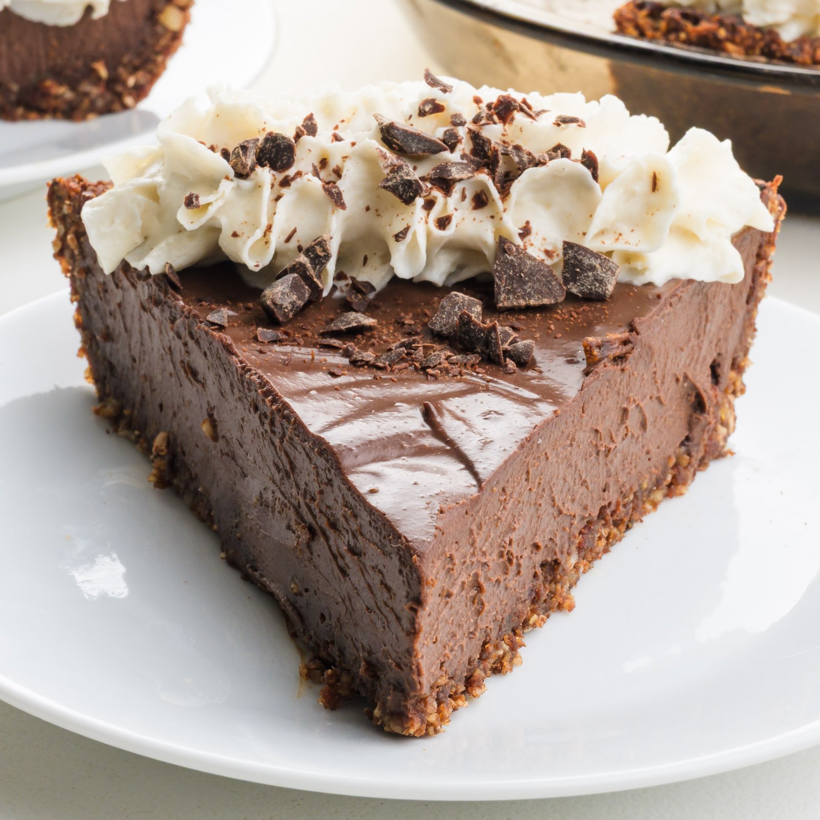 A slice of silky vegan chocolate pie on a plate.