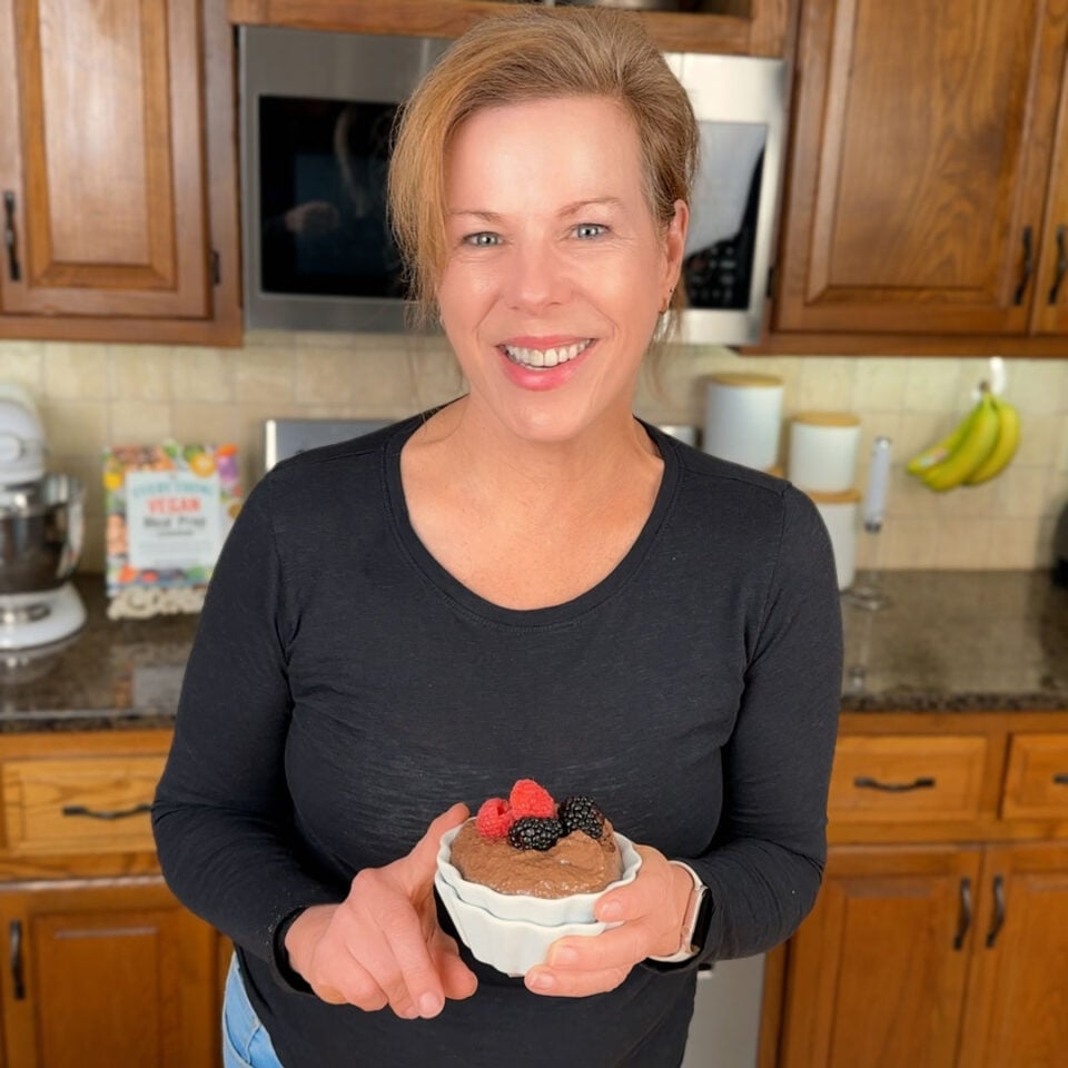 Marly holding a bowl of chocolate chia pudding.